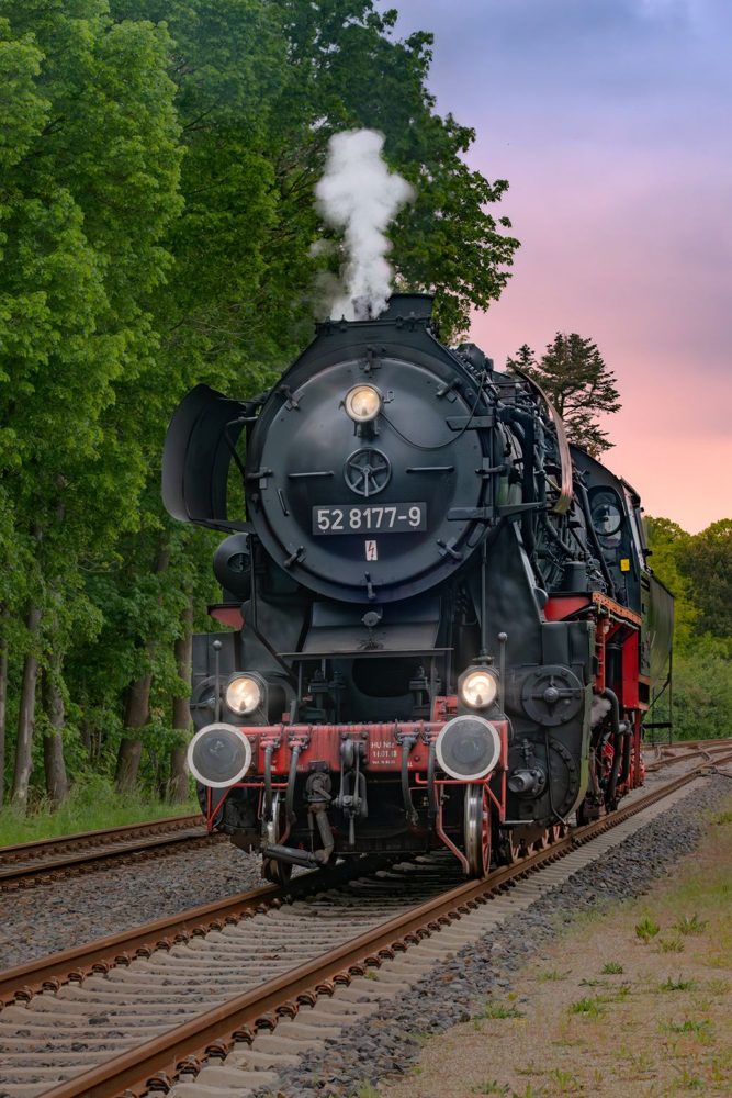 A historic steam train at dusk — illustrative stock photo, not the listed venue